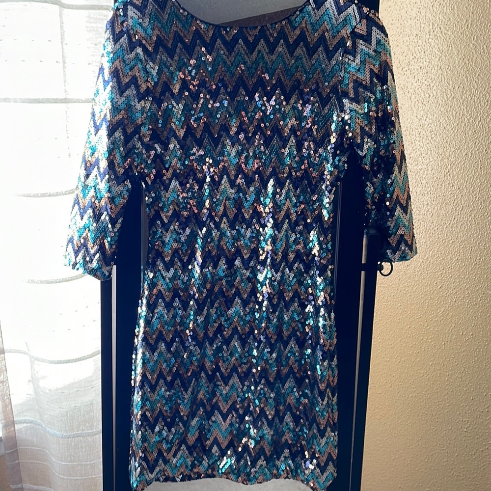 Dress originally purchased from JCPenny. It’s a junior LG and has a low dip back